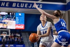 Creighton Bluejay forward Mallory Brake (14) drives to the basket during a women's college basketball game against the Drake Bulldogs Monday, November 11, 2024 in Omaha, Nebraska. Photo by Jaelle Johnson.