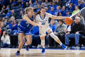 Creighton Bluejay guard Lauren Jensen (15) dribbles the ball during a women's college basketball game against the Drake Bulldogs Monday, November 11, 2024 in Omaha, Nebraska. Photo by Jaelle Johnson.