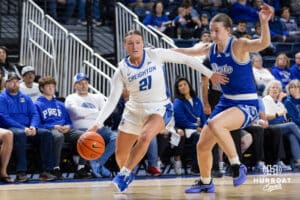Creighton Bluejay guard Molly Mogensen (21) dribbles the ball during a women's college basketball game against the Drake Bulldogs Monday, November 11, 2024 in Omaha, Nebraska. Photo by Jaelle Johnson.