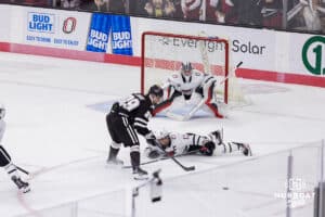 Omaha Maverick goaltender Simon Latkoczy (30) and defenseman Nolan Krenzen (12) during a college hockey match against Western Michigan Friay, November 8, 2024 in Omaha, Nebraska. Photo by Jaelle Johnson.