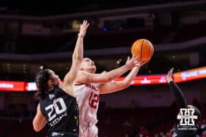 Nebraska Cornhusker forward Jessica Petrie (12) makes a layup against North Alabama Lion forward Jazzy Klinge (20) during a college women’s basektball game Tuesday, November 19, 2024 in Lincoln, Nebraska. Photo by John S. Peterson.