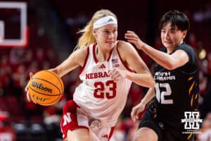 Nebraska Cornhusker guard Britt Prince (23) drives to the basket against North Alabama Lion guard Sarang West (12) during a college women’s basektball game Tuesday, November 19, 2024 in Lincoln, Nebraska. Photo by John S. Peterson.
