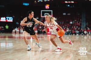 Alberte Rimdal (5) dribbles the ball next to Jazzy Klinge (20) during a college basketball game Tuesday, November 19, 2024, in Lincoln, Nebraska. Photo by Charlotte A. Gottfried.
