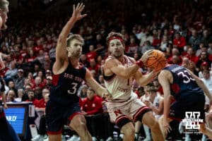 Nebraska Cornhusker guard Sam Hoiberg (1) drives to the basket against St. Mary's Gaels guard Augustas Marciulionis (3) during a college basketball game Sunday, November 17, 2024 in Sioux Falls, South Dakota.