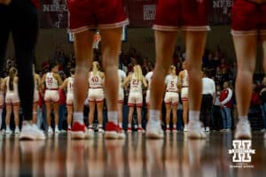 Nebraska Cornhuskers and South Dakota line for the Nation Anthem during a college women's basketball game Saturday, November 16, 2024 in Sioux Falls, South Dakota. Photo by Collin Stilen.