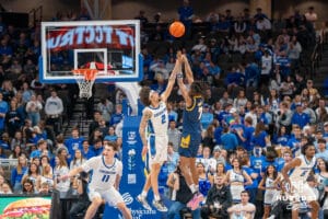 Creighton Bluejay Pop Isaac (2) defends against a jump shot from UMKC during a college basketball game Saturday, November 16th, 2024 in Omaha Nebraska. Photo by Brandon Tiedemann.
