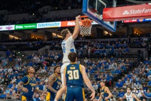 Creighton Bluejay Ryan Kalkbrenner dunk the basketball against UMKC during a college basketball game Saturday, November 16th, 2024 in Omaha Nebraska. Photo by Brandon Tiedemann.