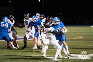 Will Gutz attempts to break a tackle during a high school football game November 15th, 2024 in Bennington Nebraska Photo by Brandon Tiedemann