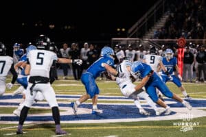 Ethan Allgood and Jack Jansen tackle Austin McMurty during a high school football game November 15th, 2024 in Bennington Nebraska Photo by Brandon Tiedemann
