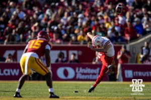 Nebraska Cornhusker punter Brian Buschini (13) kicks the ball off to USC Trojans in the second quarter during a college football game Saturday, November 16, 2024 in Los Angeles, California. Photo by John S. Peterson.