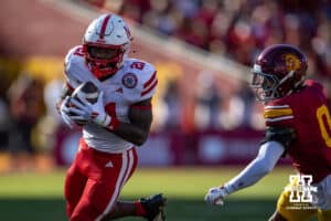 Nebraska Cornhusker running back Emmett Johnson (21) runs with the ball for a touchdown in the second quarter against USC Trojan safety Akili Arnold (0) during a college football game Saturday, November 16, 2024 in Los Angeles, California. Photo by John S. Peterson.