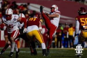 Nebraska Cornhusker punter Brian Buschini (13) punts the ball away in the first quarter against the USC Trojans during a college football game Saturday, November 16, 2024 in Los Angeles, California. Photo by John S. Peterson.