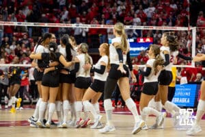 Nebraska Cornhuskers celebrate the win over the Minnesota Golden Gophers in four set during a college volleyball match Thursday, November 14, 2024, in Lincoln, Nebraska. Photo by John S. Peterson.