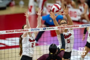 Nebraska Cornhusker Bergen Reilly (2) and Nebraska Cornhusker Rebekah Allick (5) jump to block the Minnesota Golden Gophers in the fouth set during a college volleyball match Thursday, November 14, 2024, in Lincoln, Nebraska. Photo by John S. Peterson.