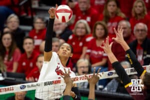 Nebraska Cornhusker Taylor Landfair (12) spikes the ball against Minnesota Golden Gophers in the third set during a college volleyball match Thursday, November 14, 2024, in Lincoln, Nebraska. Photo by John S. Peterson.