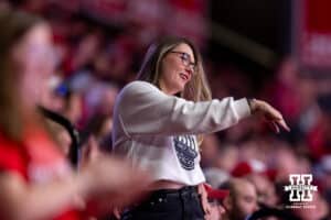 Nebraska Cornhusker fan dances to the macarana at a break in the action against the Minnesota Golden Gophers in the second set during a college volleyball match Thursday, November 14, 2024, in Lincoln, Nebraska. Photo by John S. Peterson.
