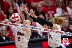 Nebraska Cornhusker Bergen Reilly (2) blocks a shot with Andi Jackson (15) against the Minnesota Golden Gophers in the second set during a college volleyball match Thursday, November 14, 2024, in Lincoln, Nebraska. Photo by John S. Peterson.
