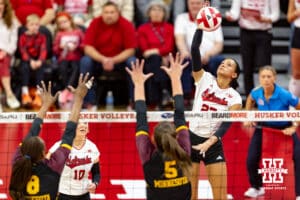 Nebraska Cornhusker Harper Murray (27) spikes the ball against Minnesota Golden Gopher Calissa Minatee (8) and Melani Shaffmaster (5) during a college volleyball match Thursday, November 14, 2024, in Lincoln, Nebraska. Photo by John S. Peterson.