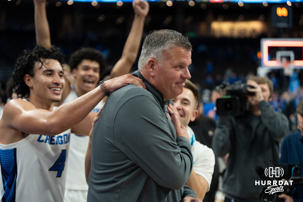 Players celebrating Greg McDermotts 328th win at Creighton November 13th, 2024 in Omaha Nebraska Photo by Brandon Tiedemann