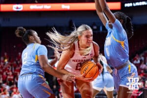 Nebraska Cornhusker forward Natalie Potts (22) drives to the basket against Southern Lady Jaguar guard Jocelyn Tate (10) and guard Aleighyah Fontenot (2) in the second half during a college basketball game Tuesday, November 12, 2024, in Lincoln, Nebraska. Photo by John S. Peterson.