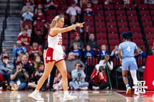 Nebraska Cornhusker forward Natalie Potts (22) points to guard Callin Hake (14), thanking her for the assist on a three-point shot against the Southern Lady Jaguars in the first half during a college basketball game Tuesday, November 12, 2024, in Lincoln, Nebraska. Photo by John S. Peterson.