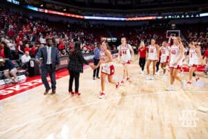 Nebraska Cornhusker head coach Amy Williams giving fives as the team heads back to the locker room after the win over the SE Louisiana Lady Lions during a women’s college baskteball game Saturday, November 9, 2024, in Lincoln, Nebraska. Photo by John S. Peterson.