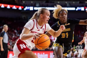 Nebraska Cornhusker guard Alberte Rimdal (5) drives the baseline against SE Louisiana Lady Lion guard Alexius Horne (31) during a women’s college baskteball game Saturday, November 9, 2024, in Lincoln, Nebraska. Photo by John S. Peterson.