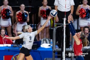 Elkhorn North's Reagan Wallraff (9) tips the ball over the net against Norris during the semi-finals of the 2024 NSAA Volleyball Championships Friday, November 8, 2024, in Lincoln, Nebraska. Photo by John S. Peterson.