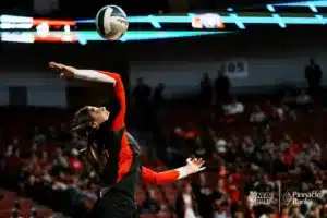 Norfolk Catholic's Ava Wemhoff (15) serves theb all against Yutan during the NSAA State Volleyball Quarterfinals on November 6th, 2024 at Pinnacle Bank Arena in Lincoln, Nebraska. Photo by Mike Sautter.