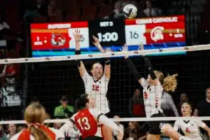 Superior's Reagan Meyers (12) and Jordan Duncan jump to block a shot from Cedar Catholic's Addison Walter during the NSAA State Volleyball Quarterfinals on November 6th, 2024 at Pinnacle Bank Arena in Lincoln, Nebraska. Photo by Mike Sautter.