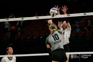 Howells-Dodge's Bella Koliha (10) spikes the ball against BDS's Kinzley Bohling (16) during the NSAA State Volleyball Quarterfinals on November 6th, 2024 at Pinnacle Bank Arena in Lincoln, Nebraska. Photo by Mike Sautter.