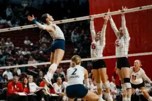 Central Valley's Margrett Kriewald (21) spikes the ball against Amherst's Lucy Van Ranken (15) and Sadie Van Ranken(12) during the NSAA State Volleyball Quarterfinals on November 6th, 2024 at Pinnacle Bank Arena in Lincoln, Nebraska. Photo by Mike Sautter.