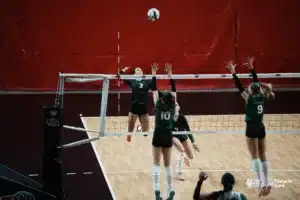 Millard West Wildcat Malia Fichtl (3) spikes the ball against Southwest Silverhawk Alivia Gustafson (10) during the NSAA State Volleyball quarterfinals at Pinnacle Bank Arena on November 6th, 2024. Photo by Mike Sautter.