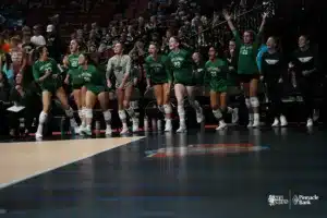 Paige Meister, Rachel Gwinn, Nicole Ott, Kiera Link, Amelia Boone, Anya Kolli and Kayelyn Liebentritt cheer during NSAA State Volleyball quarterfinals vs Lincoln Pius X at Pinnacle Bank Arena on November 6th, 2024. Photo by Mike Sautter