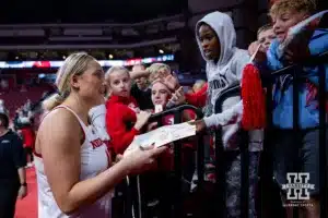 Nebraska Cornhusker center Alexis Markowski (40) signs an autograph for fans after the win over the Omaha Mavericks during a college women’s baskteball game Monday, November 4, 2024, in Lincoln, Nebraska. Photo by John S. Peterson.