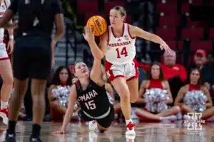 Nebraska Cornhusker guard Callin Hake (14) dribbles away from Omaha Maverick forward Paige Horne (15) in the second half during a college women’s baskteball game Monday, November 4, 2024, in Lincoln, Nebraska. Photo by John S. Peterson.