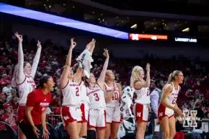 Nebraska Cornhusker banch celebrates a three against the Omaha Mavericks in the second half during a college women’s baskteball game Monday, November 4, 2024, in Lincoln, Nebraska. Photo by John S. Peterson.