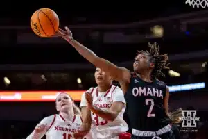Omaha Maverick guard Lauren Perry (2) reaches for a rebound against the Nebraska Cornhuskers in the second half during a college women’s baskteball game Monday, November 4, 2024, in Lincoln, Nebraska. Photo by John S. Peterson.