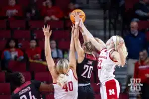Nebraska Cornhusker center Alexis Markowski (40) and guard Britt Prince (23) go for a rebound against Omaha Maverick guard Grace Cave (20) in the first half during a college women’s baskteball game Monday, November 4, 2024, in Lincoln, Nebraska. Photo by John S. Peterson.