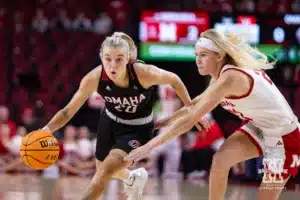 Omaha Maverick guard Grace Cave (20) dribbles the ball against Nebraska Cornhusker guard Britt Prince (23) in the first half during a college women’s baskteball game Monday, November 4, 2024, in Lincoln, Nebraska. Photo by John S. Peterson.