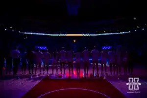 Nebraska Cornhuskers lock arm for the National Anthem before taking on the Omaha Mavericks during a college women’s baskteball game Monday, November 4, 2024, in Lincoln, Nebraska. Photo by John S. Peterson.