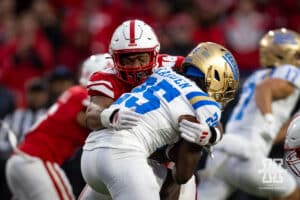 Nebraska Cornhusker linebacker MJ Sherman (48) tackles UCLA Bruin running back T.J. Harden (25) in the fourth quarter during a college football game Saturday, November 2, 2024, in Lincoln, Nebraska. Photo by John S. Peterson.