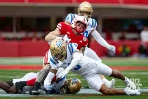 Nebraska Cornhusker tight end Thomas Fidone II (24) tackled by UCLA Bruin defensive back Kaylin Moore (9) and defensive back K.J. Wallace (7) during a college football game Saturday, November 2, 2024, in Lincoln, Nebraska. Photo by John S. Peterson.