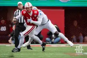 Nebraska Cornhusker quarterback Dylan Raiola (15) tackled by UCLA Bruin linebacker Oluwafemi Oladejo (2) in the second quarter during a college football game Saturday, November 2, 2024, in Lincoln, Nebraska. Photo by John S. Peterson.