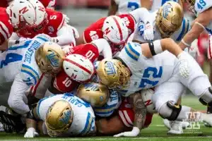 Nebraska Cornhusker defensive lineman Ty Robinson (9) tackles UCLA Bruin running back T.J. Harden (25) in the first quarter during a college football game Saturday, November 2, 2024, in Lincoln, Nebraska. Photo by John S. Peterson.