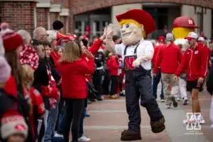 Nebraska Cornhusker Herbie giving high fives during a college football game Saturday, November 2, 2024, in Lincoln, Nebraska. Photo by John S. Peterson.