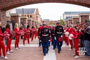 The Marines walk up the Legacy Walk before the Huskers arrive during a college football game Saturday, November 2, 2024, in Lincoln, Nebraska. Photo by John S. Peterson.