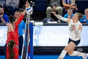 Creighton Bluejay defensive specialist Morgan Colangelo (13) spikes the ball against the St. John's Red Storm in the second set during a college volleyball match Friday, November 1, 2024, in Omaha, Nebraska. Photo by John S. Peterson.