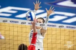 Creighton Bluejay outside hitter Norah Sis (2) jumps up to block a shot against the St. John's Red Storm in the first set during a college volleyball match Friday, November 1, 2024, in Omaha, Nebraska. Photo by John S. Peterson.