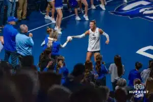 Creighton Bluejay outside hitter Ava Martin (8) hands a mini.volleyball to a fan before taking on the St. John's Red Storm.during college basketball game October 26, 2024 in Omaha Nebraska Photo by Brandon Tiedemann